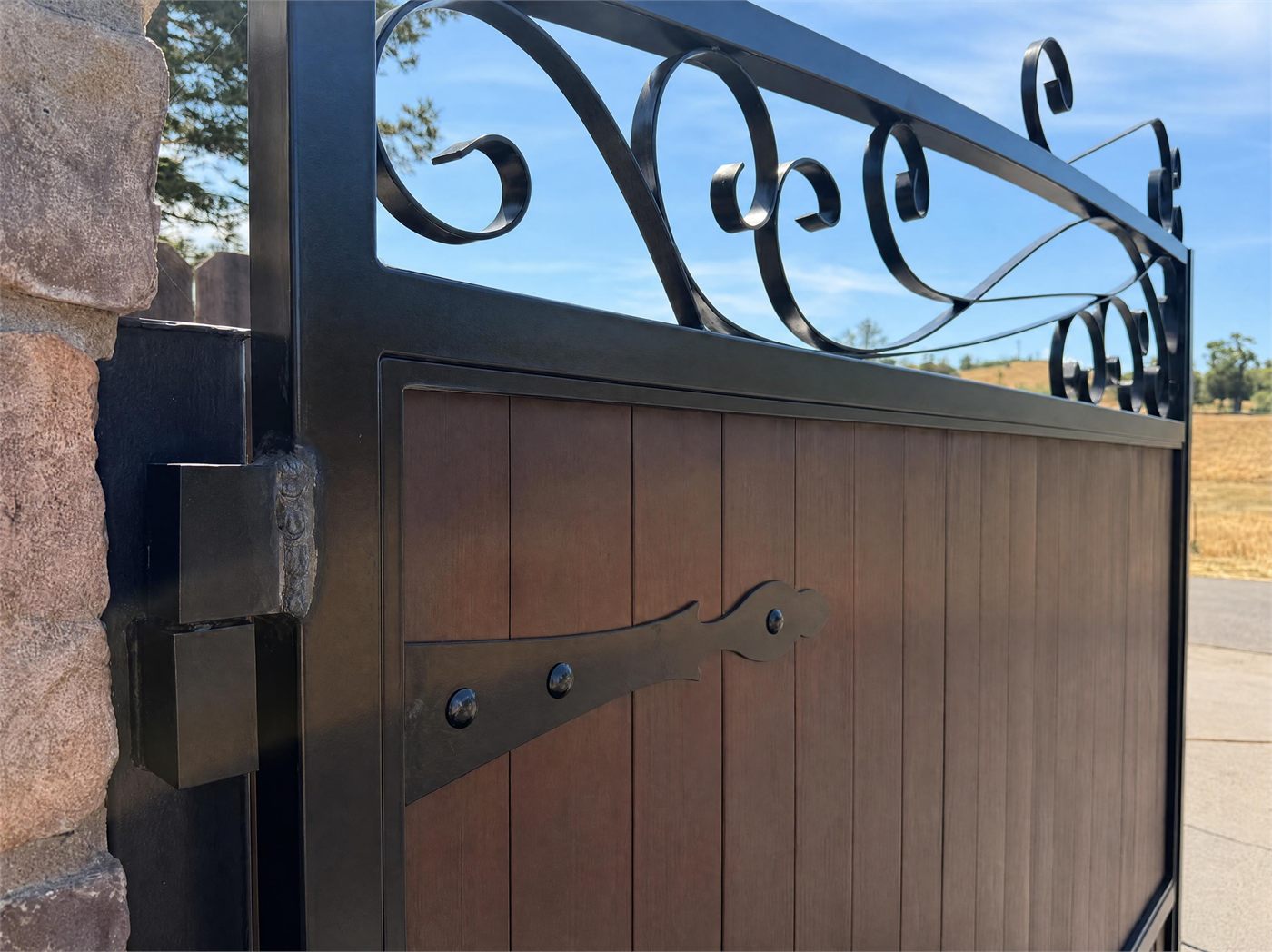 Detail of a custom welded gate with ornamental scrollwork